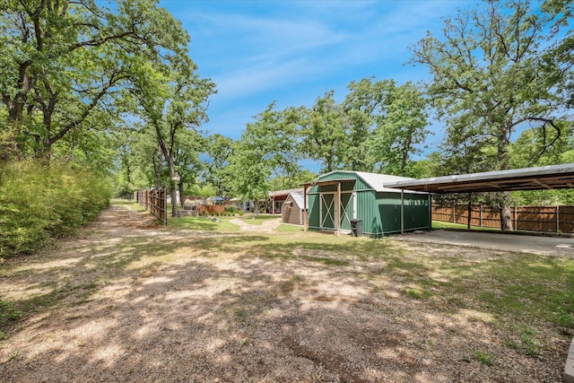 635 Old Justin Rd, Argyle, TX 76226 - view of yard featuring fence and an outbuilding