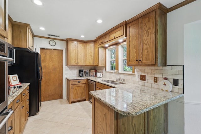 4401 Longacres Ct, Arlington, TX 76016 - kitchen featuring a sink, stainless steel dishwasher, decorative backsplash, light stone counters, and brown cabinets