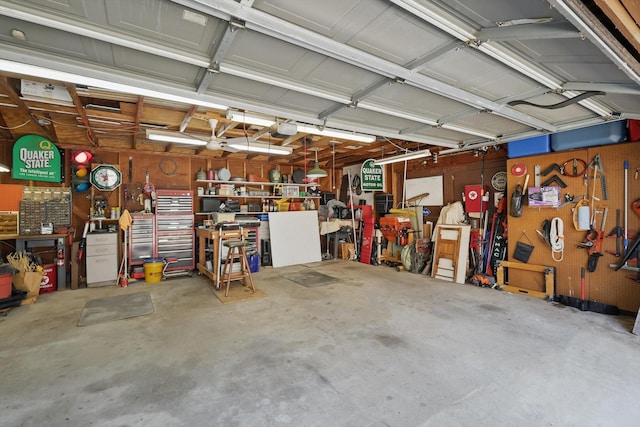 4401 Longacres Ct, Arlington, TX 76016 - garage with a workshop area and a garage door opener