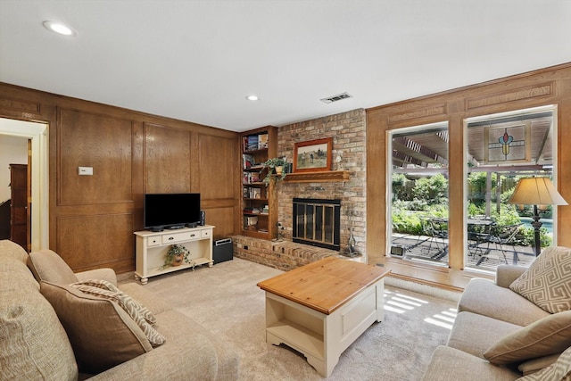 4401 Longacres Ct, Arlington, TX 76016 - living room featuring wooden walls, light colored carpet, a brick fireplace, and recessed lighting