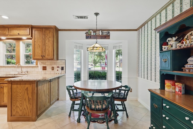 4401 Longacres Ct, Arlington, TX 76016 - dining space with crown molding, wallpapered walls, baseboards, and light tile patterned flooring