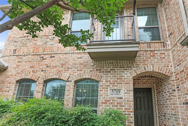 5719 Butterfly Way, Fairview, TX 75069 - view of exterior entry with brick siding and a balcony