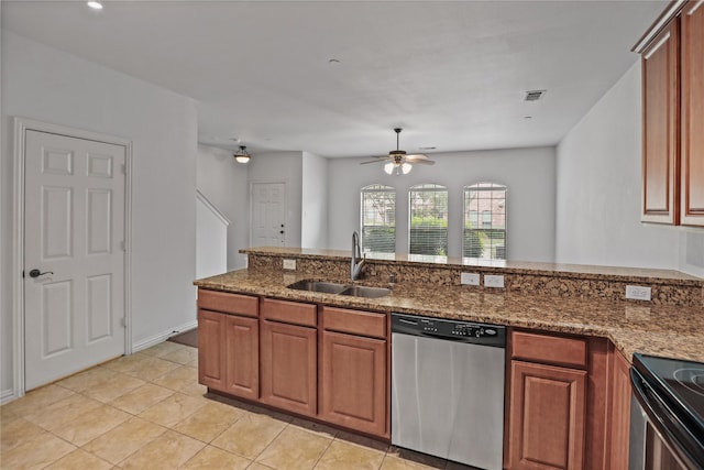 5719 Butterfly Way, Fairview, TX 75069 - kitchen with stainless steel dishwasher, ceiling fan, brown cabinets, and dark stone countertops