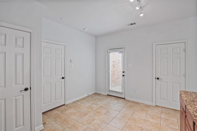 5719 Butterfly Way, Fairview, TX 75069 - empty room with light tile patterned floors and baseboards