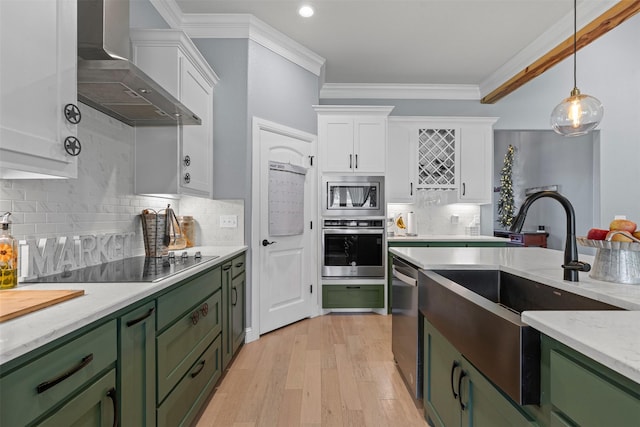 101 Cedar Mountain Dr, Weatherford, TX 76085 - kitchen with green cabinetry, stainless steel appliances, wall chimney exhaust hood, white cabinets, and a sink
