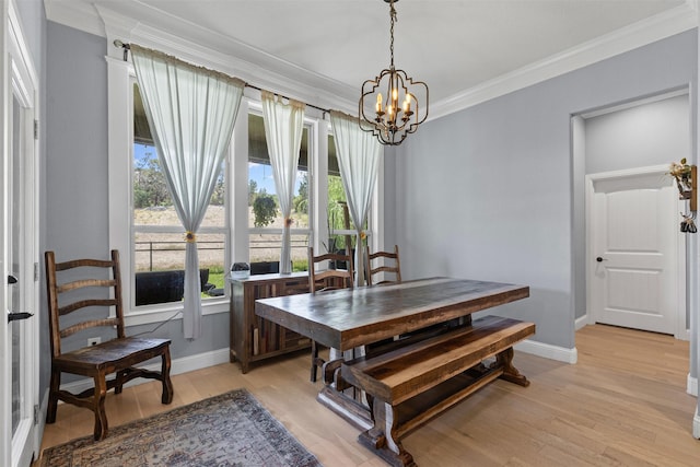 101 Cedar Mountain Dr, Weatherford, TX 76085 - dining space with crown molding, baseboards, a chandelier, and light wood-style flooring