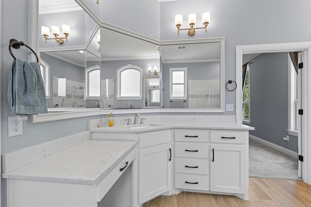 101 Cedar Mountain Dr, Weatherford, TX 76085 - bathroom featuring ornamental molding, a shower, vanity, and wood finished floors