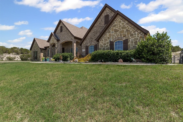 101 Cedar Mountain Dr, Weatherford, TX 76085 - french country style house with stone siding, a front yard, and brick siding