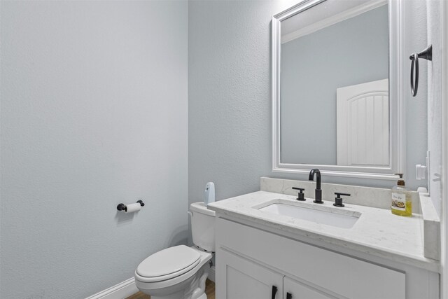 101 Cedar Mountain Dr, Weatherford, TX 76085 - half bath featuring vanity, toilet, and a textured wall
