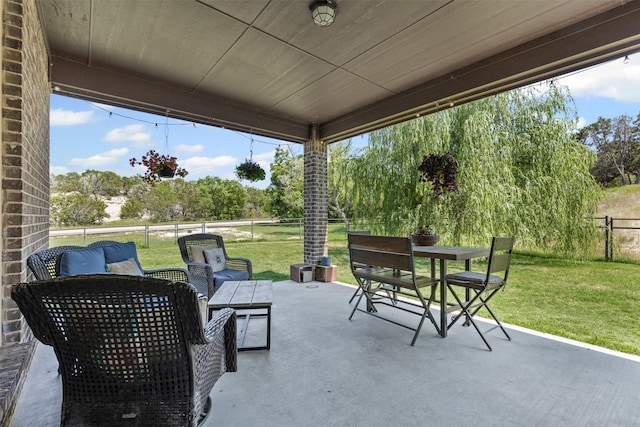 101 Cedar Mountain Dr, Weatherford, TX 76085 - view of patio with outdoor dining area, view of scattered trees, and an outdoor hangout area