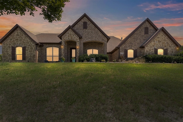 101 Cedar Mountain Dr, Weatherford, TX 76085 - french provincial home featuring stone siding, a lawn, and brick siding