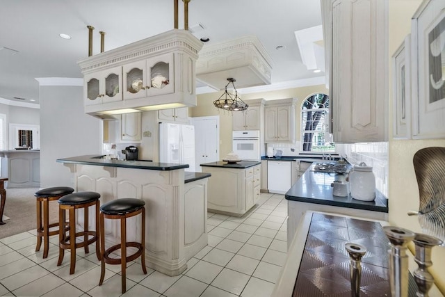 5503 Arch Bridge Ct, Arlington, TX 76017 - kitchen with white appliances, ornamental molding, light tile patterned flooring, dark countertops, and decorative backsplash