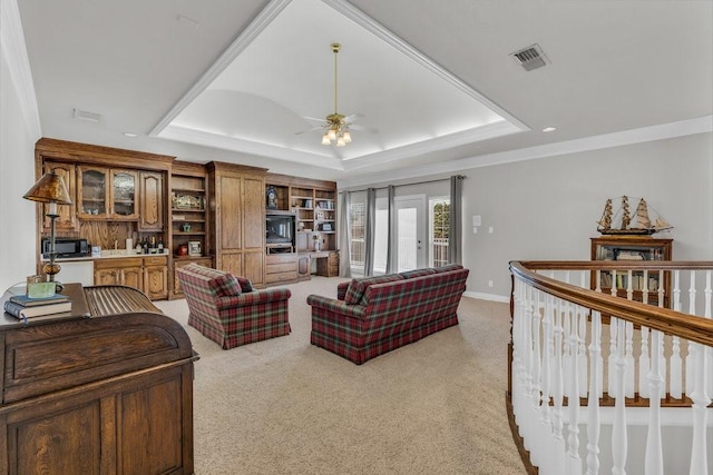 5503 Arch Bridge Ct, Arlington, TX 76017 - living room with a tray ceiling, ceiling fan, light colored carpet, and baseboards