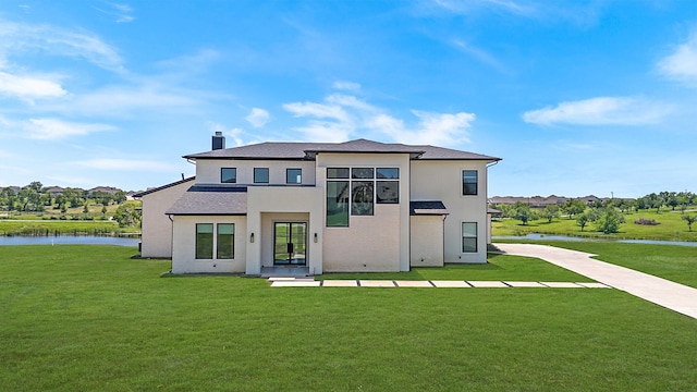 10356 Wild Rose Cir, Forney, TX 75126 - rear view of house featuring a yard, a chimney, and a water view
