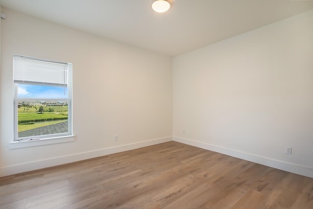10356 Wild Rose Cir, Forney, TX 75126 - empty room featuring baseboards and light wood-style flooring