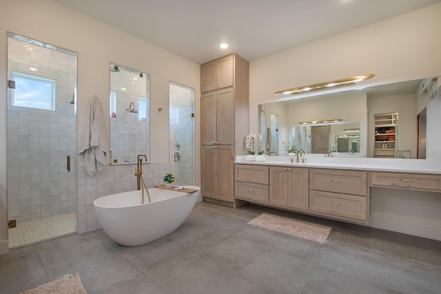 10356 Wild Rose Cir, Forney, TX 75126 - full bath with a shower stall, vanity, a freestanding tub, recessed lighting, and concrete floors