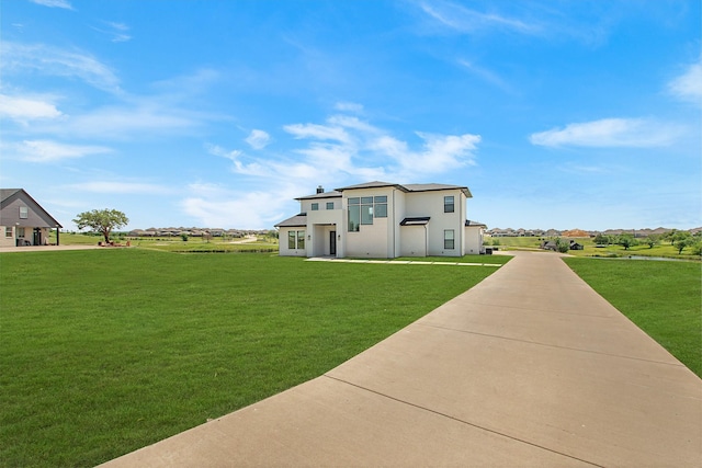 10356 Wild Rose Cir, Forney, TX 75126 - view of front facade with a front lawn and stucco siding