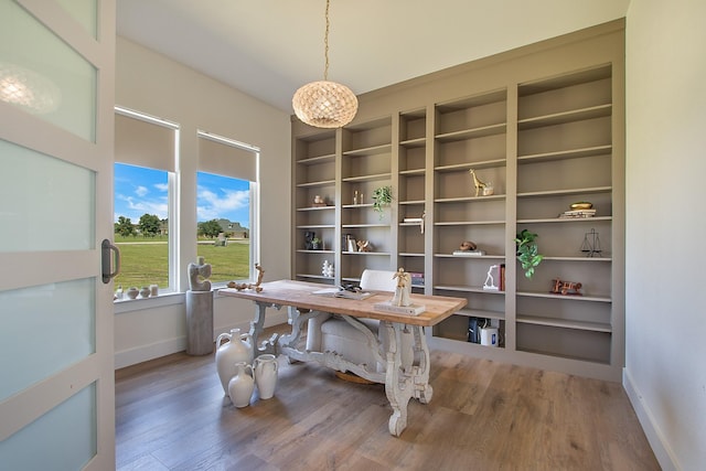 10356 Wild Rose Cir, Forney, TX 75126 - home office featuring baseboards, built in features, and wood finished floors