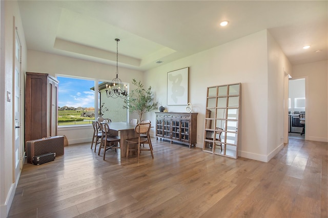 10356 Wild Rose Cir, Forney, TX 75126 - dining area featuring wood finished floors, baseboards, a chandelier, a raised ceiling, and recessed lighting