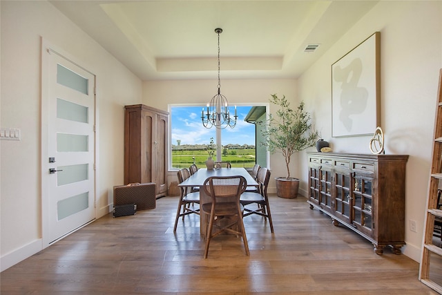 10356 Wild Rose Cir, Forney, TX 75126 - dining room with a tray ceiling, a chandelier, wood finished floors, and baseboards