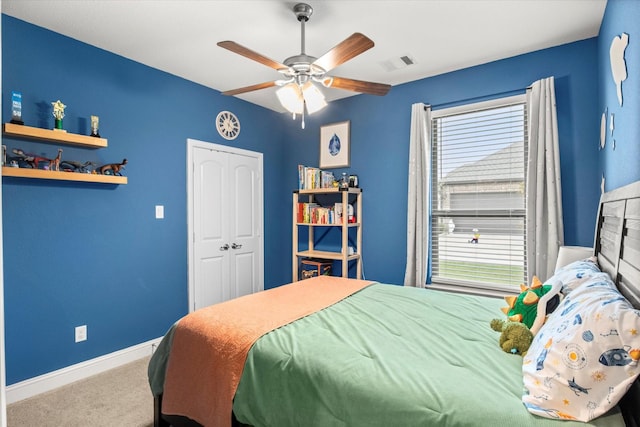 bedroom with multiple windows, carpet, baseboards, and a ceiling fan