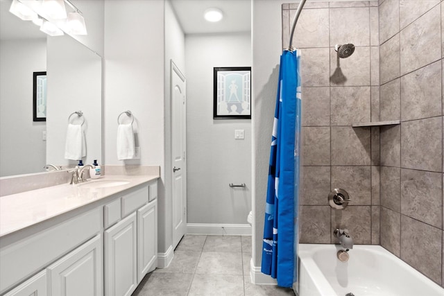 full bath with shower / bathtub combination with curtain, baseboards, vanity, and tile patterned floors