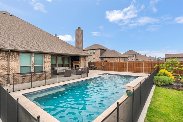 view of swimming pool featuring outdoor lounge area, a patio area, and a fenced backyard