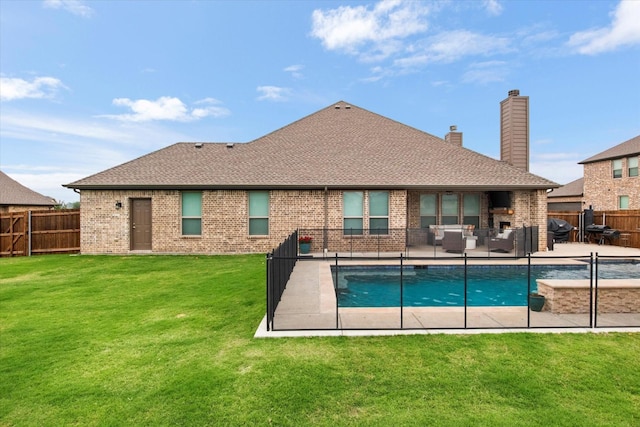 rear view of property with brick siding, a patio, a chimney, and roof with shingles
