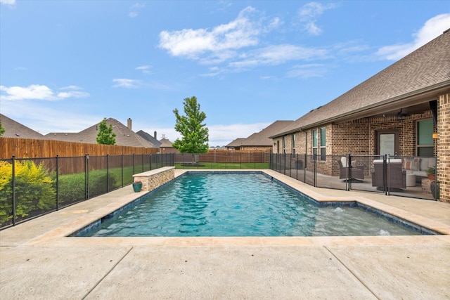 view of swimming pool featuring a fenced backyard and a patio