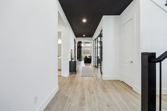 3791 Lockhart Dr, Prosper, TX 75078 - corridor featuring light wood-type flooring, baseboards, recessed lighting, and french doors