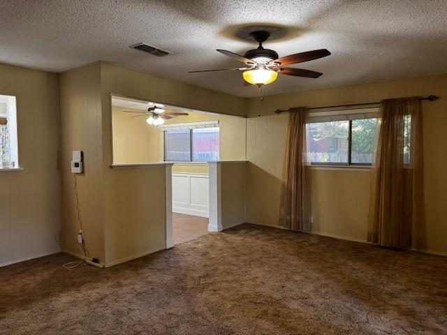 7625 Deaver Dr, North Richland Hills, TX 76180 - spare room with carpet flooring, a textured ceiling, and a ceiling fan