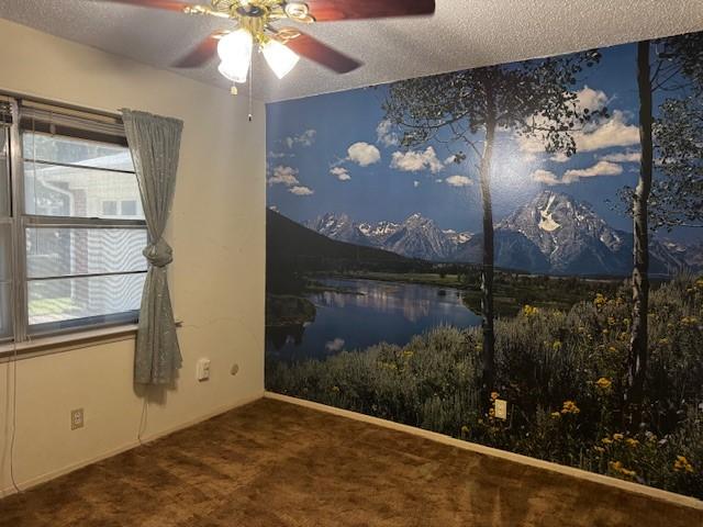 7625 Deaver Dr, North Richland Hills, TX 76180 - empty room featuring ceiling fan, carpet flooring, a textured ceiling, plenty of natural light, and a water view