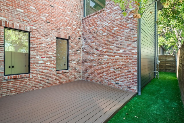 wooden deck featuring fence