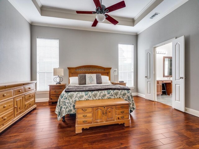 1710 Redcedar Dr, Wylie, TX 75098 - bedroom featuring a raised ceiling, ornamental molding, dark wood finished floors, and baseboards