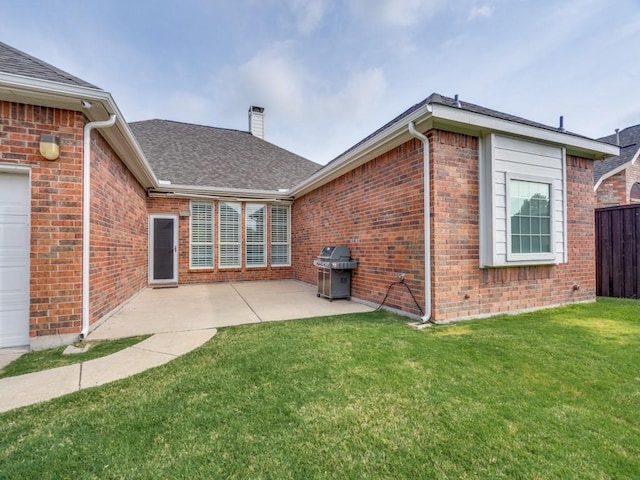 1710 Redcedar Dr, Wylie, TX 75098 - back of house featuring brick siding, a chimney, a shingled roof, and a patio