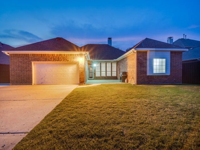 1710 Redcedar Dr, Wylie, TX 75098 - single story home with brick siding, a chimney, a garage, driveway, and a front lawn