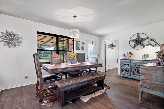 233 Reast Rd, Whitesboro, TX 76273 - dining space featuring dark wood-style flooring, a chandelier, and baseboards