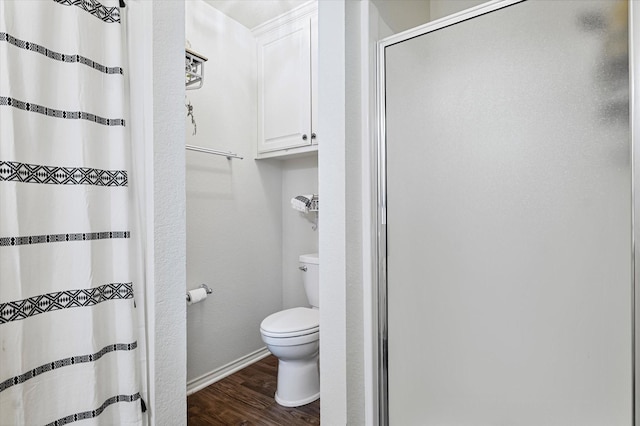 233 Reast Rd, Whitesboro, TX 76273 - full bath featuring a stall shower, wood finished floors, toilet, and baseboards
