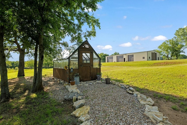 233 Reast Rd, Whitesboro, TX 76273 - view of green lawn with a greenhouse and an outbuilding