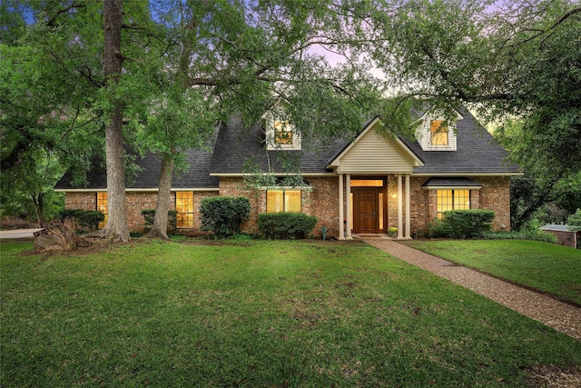 444 Lost Forest Ln, Marlin, TX 76661 - view of front of property with a front lawn, brick siding, and roof with shingles