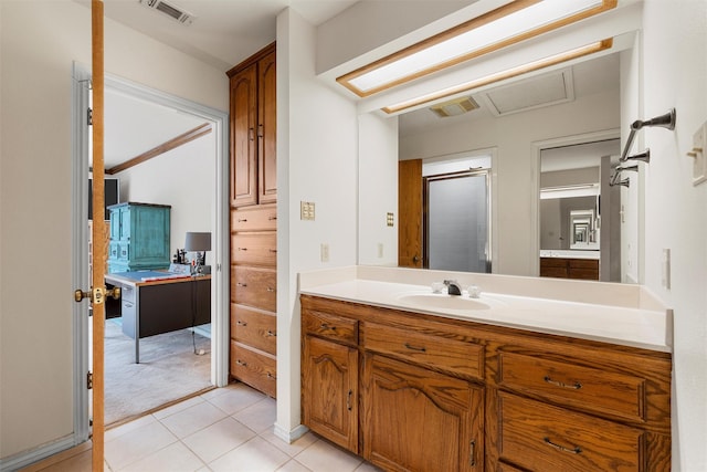 444 Lost Forest Ln, Marlin, TX 76661 - bathroom featuring vanity, tile patterned floors, and a shower