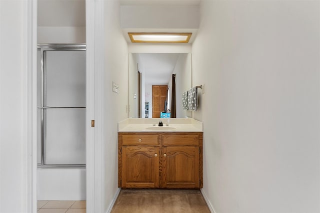 444 Lost Forest Ln, Marlin, TX 76661 - full bathroom with vanity, baseboards, and bath / shower combo with glass door