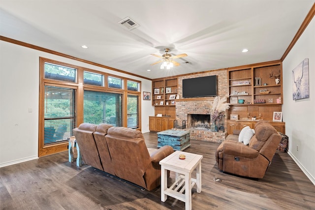 444 Lost Forest Ln, Marlin, TX 76661 - living area featuring ornamental molding, baseboards, a ceiling fan, a brick fireplace, and dark wood-style flooring