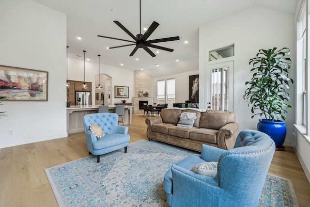 4108 Fall Aster Way, Aubrey, TX 76227 - living area with vaulted ceiling, a ceiling fan, light wood-type flooring, recessed lighting, and arched walkways