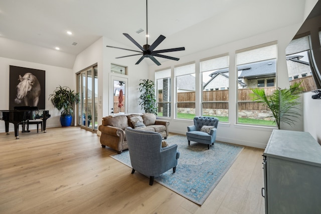 4108 Fall Aster Way, Aubrey, TX 76227 - living area with plenty of natural light, lofted ceiling, ceiling fan, light wood finished floors, and baseboards