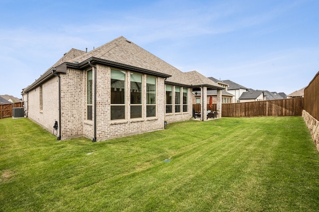 4108 Fall Aster Way, Aubrey, TX 76227 - rear view of house with brick siding, central AC, and roof with shingles