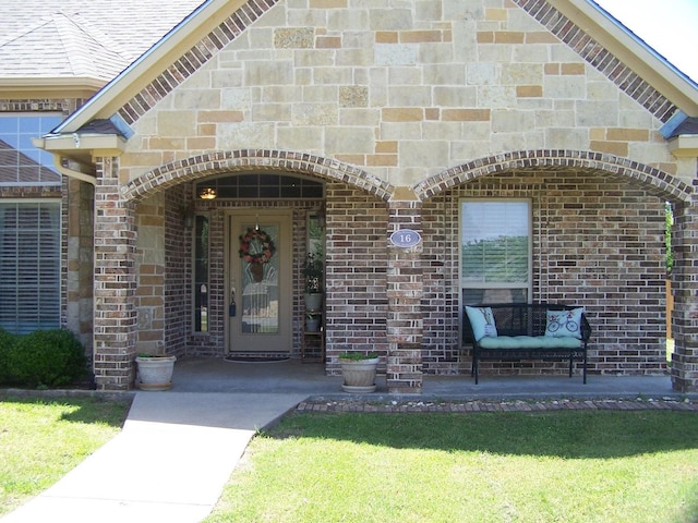 16 Cedar Bayou Cir, Pottsboro, TX 75076 - doorway to property featuring brick siding