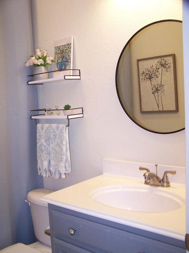 16 Cedar Bayou Cir, Pottsboro, TX 75076 - bathroom featuring vanity and toilet