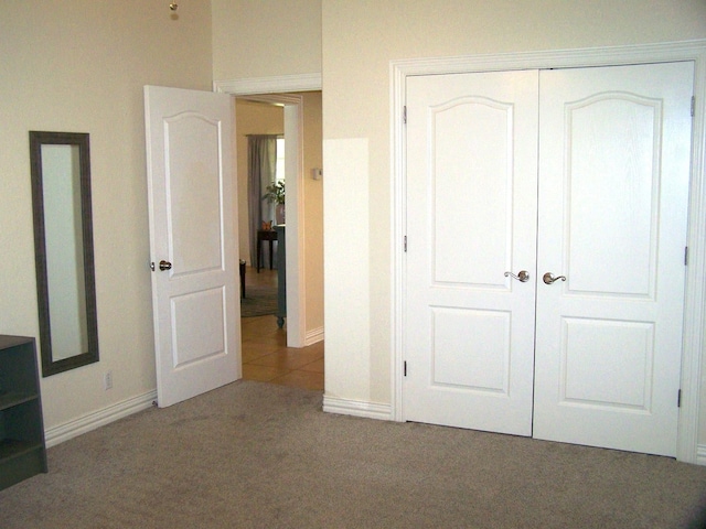 16 Cedar Bayou Cir, Pottsboro, TX 75076 - unfurnished bedroom with carpet flooring, baseboards, and a closet