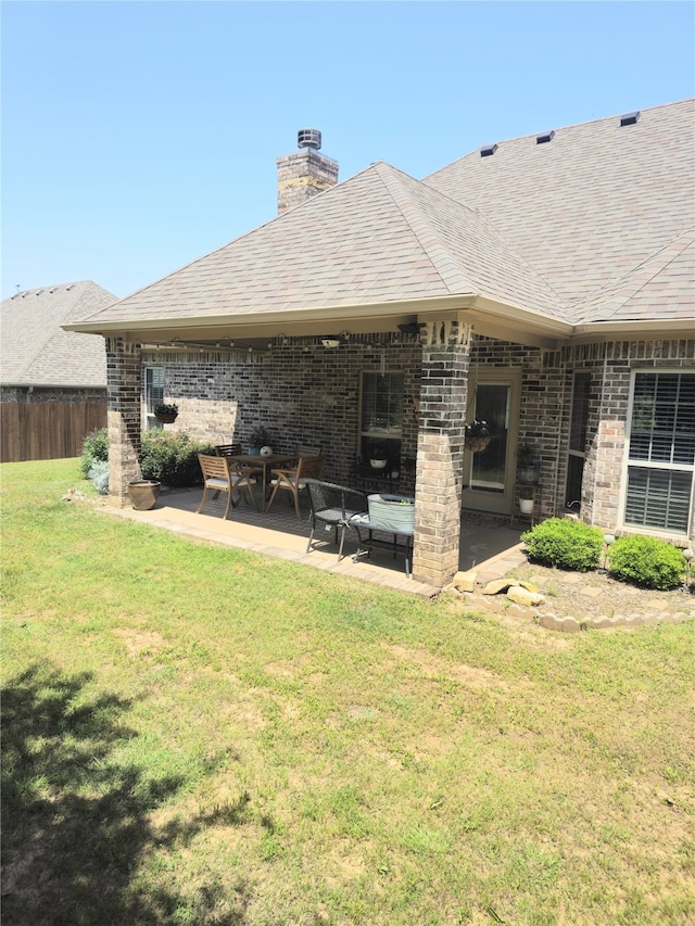 16 Cedar Bayou Cir, Pottsboro, TX 75076 - back of property with a patio, brick siding, a chimney, and a shingled roof